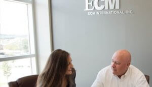 Two ECM employees in a meeting at the ECM International office